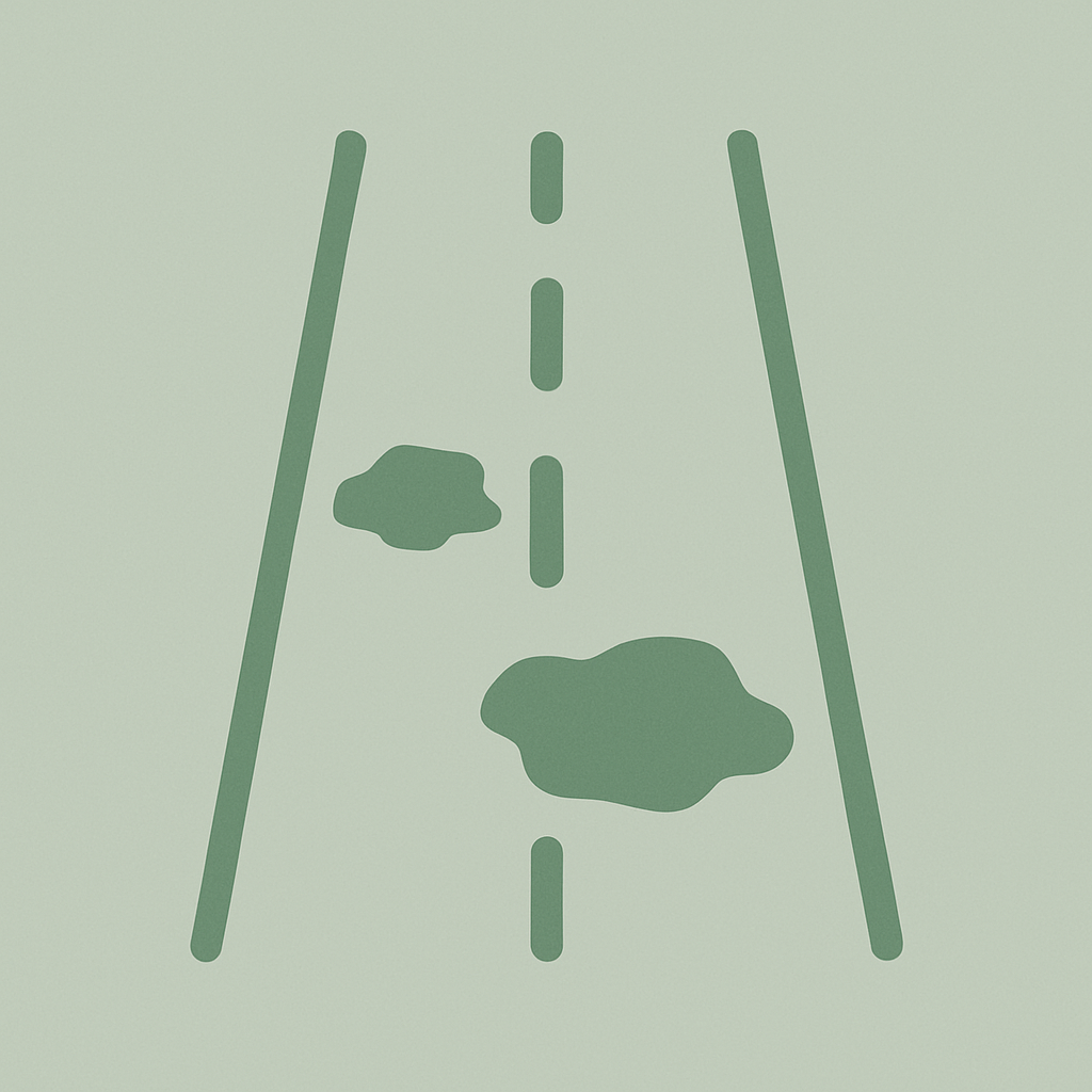 Icon of a road with two potholes in it